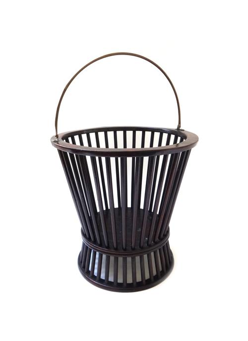 A George III mahogany bucket, with waisted open spindle turned body, on flared base, 34cm wide x 34cm high. Illustrated.