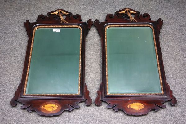 A pair of 18th century style fret cut wall mirrors, circa 1900, each with gilt ho-ho bird surmount and conch shell inlaid frieze, 54cm wide x 92cm hig