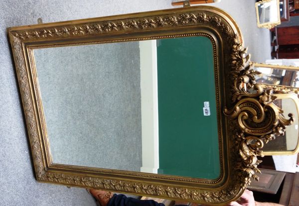 A 19th century French gilt framed wall mirror, with opposing 'C' scroll crest over bevelled plate, 77cm wide x 123cm high.
