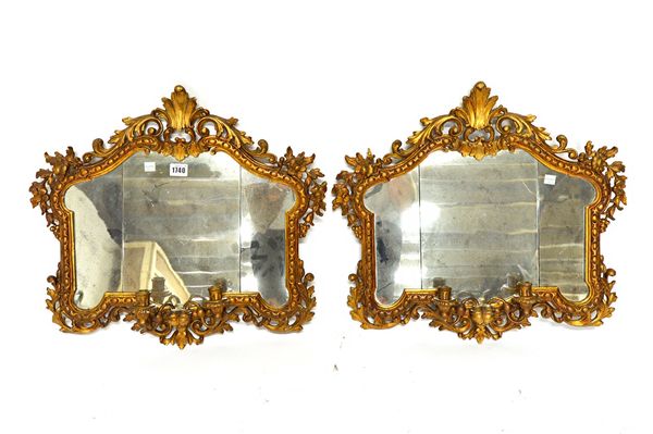 A pair of 18th century design gilt framed girandole wall mirrors, with floral chased egg and dart carved frame, over a pair of candle holders about th