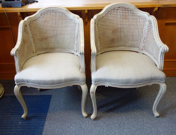 A pair of Louise XV style grey painted tub back fauteuils, with bow seat and cabriole supports. (2)