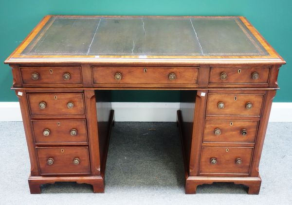 A mahogany pedestal desk, circa 1900, with nine drawers about the knee, on bracket feet, 121cm wide.