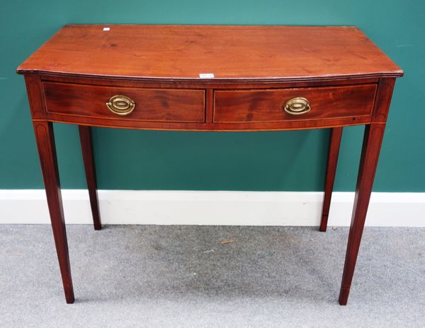 A 19th century inlaid mahogany bowfront two drawer writing table, on tapering square supports, 91cm wide.