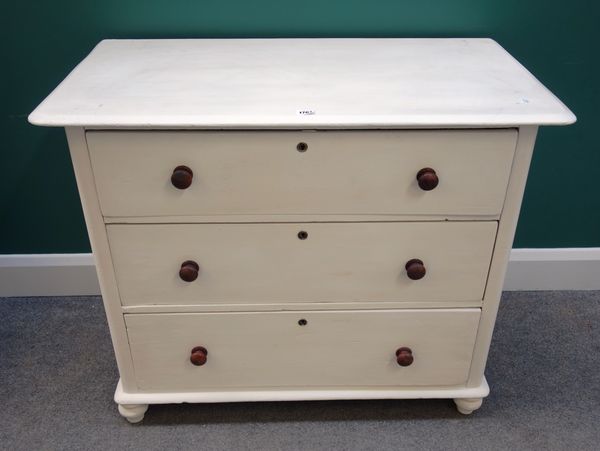 A 19th century later cream painted chest of three long drawers, on turned feet, 95cm wide.