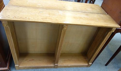 A pair of 18th century style pine floor standing twin section open bookcases, on plinth base, 115cm wide.