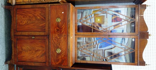 A Regency mahogany secretaire, the pair of astragal glazed doors over fitted drawer and pair of cupboards, on splayed bracket feet, 92cm wide x 223cm