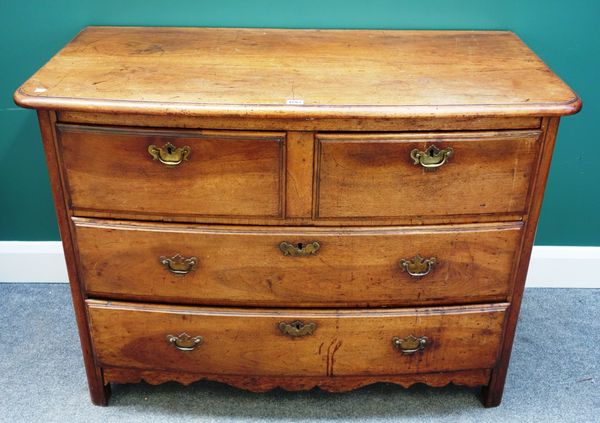 An early 19th century French walnut bowfront commode of two short and two long drawers, over shaped frieze, 115cm wide.