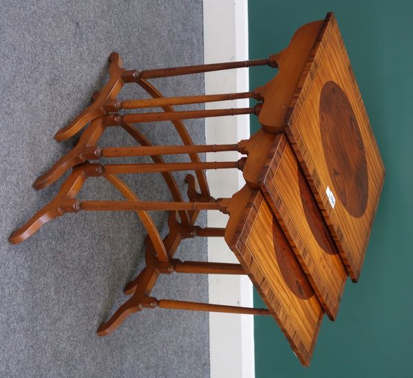 A nest of three early 20th century satinwood and rosewood occasional tables, on turned supports united by a concave stretcher, the largest 50cIn good