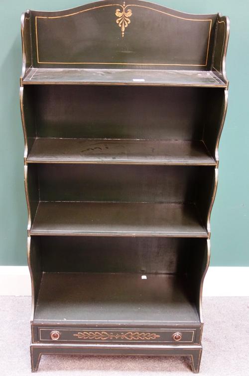 A Regency style parcel gilt green painted waterfall four tier bookcase with single drawer base on bracket feet, 60cm wide.