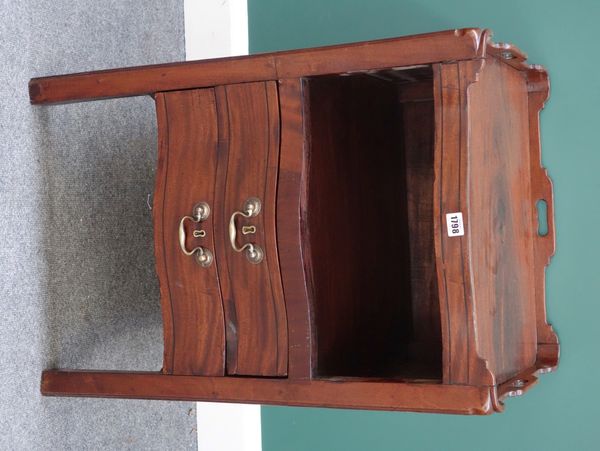 A mid-18th century mahogany tray top night stand, the serpentine front with open recess over pair of drawers, on square supports, 55cm wide.