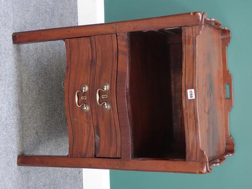 A mid-18th century mahogany tray top night stand, the serpentine front with open recess over pair of drawers, on square supports, 55cm wide.
