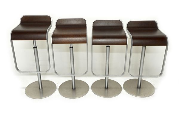 Lapama, Italy; a set of four 20th century polished steel and laminated hardwood height adjustable stools with integral footrest and circular base (4).