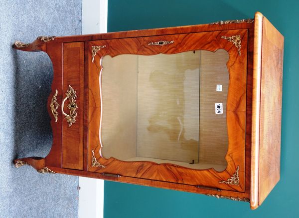 A 19th century Continental gilt metal mounted walnut vitrine, with shaped glazed door over single drawer and cabriole supports, 56cm wide.