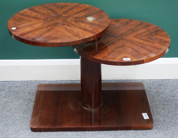 A 20th century macassar occasional table, of split level circular form, on a rectangular base, 65cm wide.