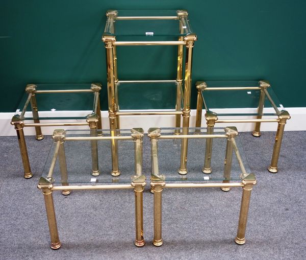 A 20th century square lacquered brass and glass two tier etagere on octagonal supports, 40cm wide and four matching tables, (5).Property from the esta