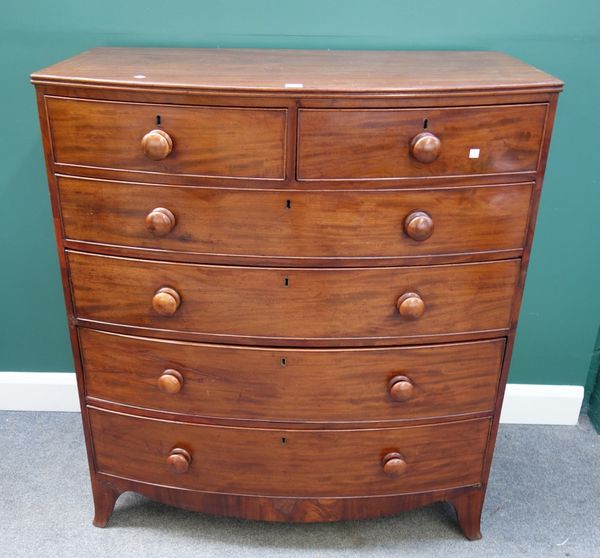 An early Victorian mahogany bowfront chest of two short and four long graduated drawers, on splayed bracket feet, 106cm wide.