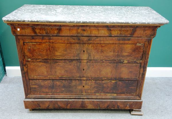 A 19th century French commode, the rectangular black marble top over a walnut five drawer base, on splayed block feet, 130cm wide.