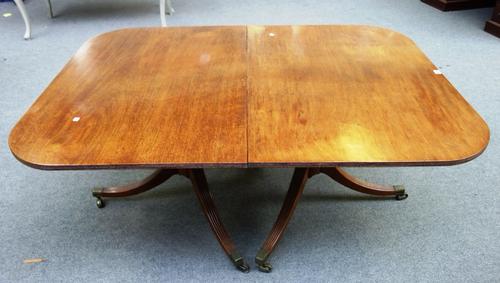 An early 19th century mahogany 'D' end extending dining table on six downswept supports,to include two extra leaves, 115cm wide x 156cm long x 272cm l