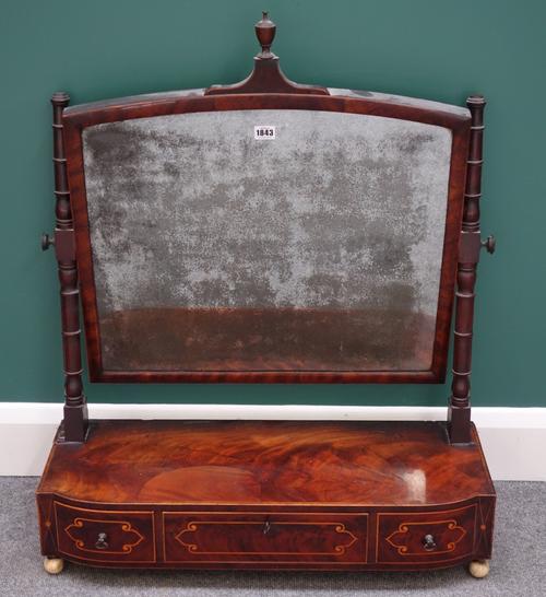 A large William IV inlaid mahogany toilet mirror, with bowfront three drawer base, 75cm wide.