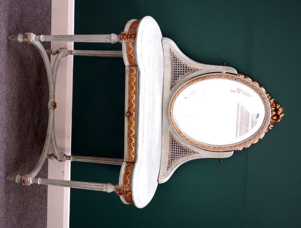 A Louis XVI style blue painted parcel gilt dressing table, with swing mirror over single frieze drawer on fluted supports, 98cm wide.