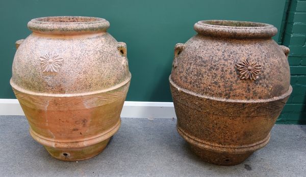 A pair of large 20th century terracotta oil jars with lug handles, 92cm high.