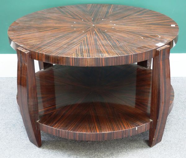 A 20th century inlaid macassar circular two tier table, on four shaped supports, 79cm wide.