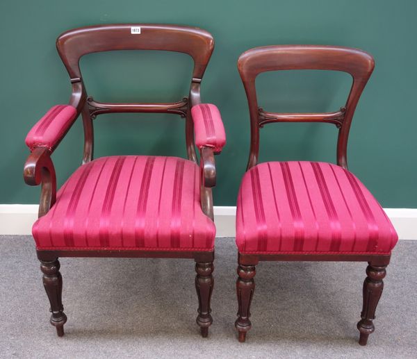 'G. Jackson'; a set of seven Victorian mahogany spoon back dining chairs, on lappet carved supports, to include one carver (7).