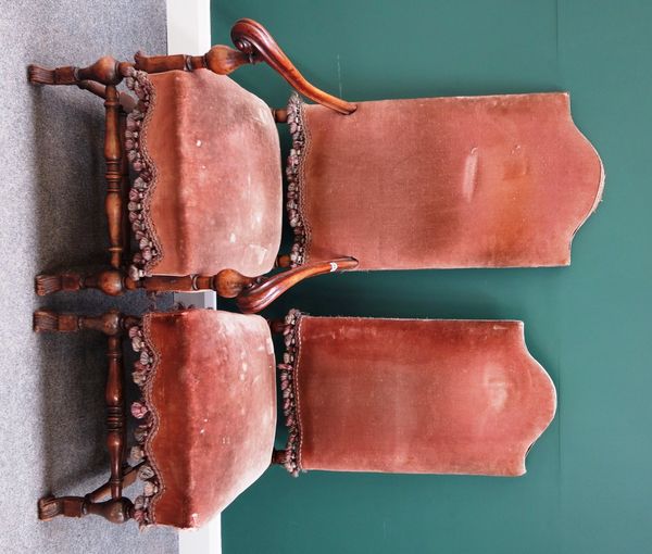 A set of eight walnut framed high back dining chairs of 17th century Flemish design, to include a pair of carvers (8).