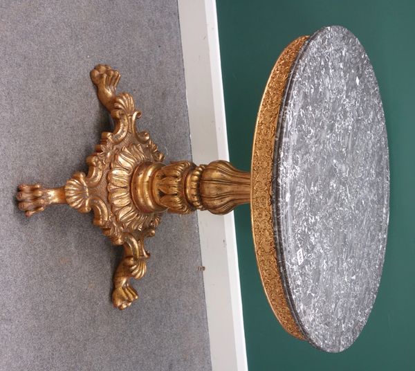 A 19th century centre table, the ribbed circular marble top on a giltwood base, with reeded baluster column, shaped platform and four lions paw feet,