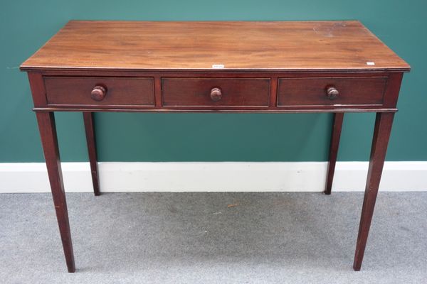 A 19th century mahogany three drawer writing table on tapering square supports, 106cm wide.Property from the estates of the late Adrian Stanford and N