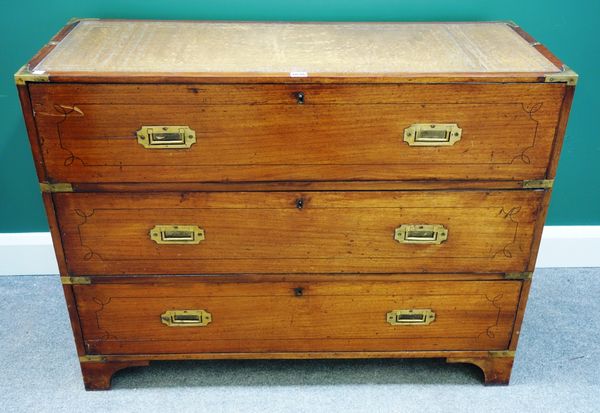 A 19th century mahogany campaign style chest of three long drawers, with recessed brass handles and inset leather top, 107cm wide (adapted).