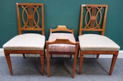 A pair of Biedermeier birch square back side chairs, together with a similar stool, 56cm wide.
