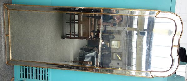 An early 19th century gilt framed arch top marginal wall mirror of Queen Anne design, with bevelled mirror plates, 80cm wide x 216cm high.