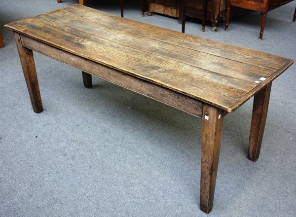 A George III and later dining table, the rectangular plank top on tapering square supports, 67cm x 178cm.