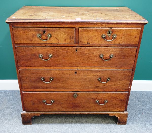 An 18th century elm chest of two short and three long graduated drawers, on bracket feet, 102cm wide.