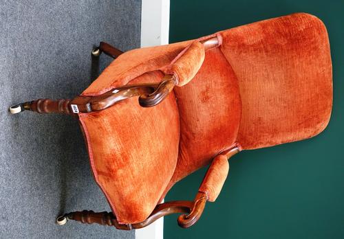 A William IV open armchair, with serpentine seat on turned supports.