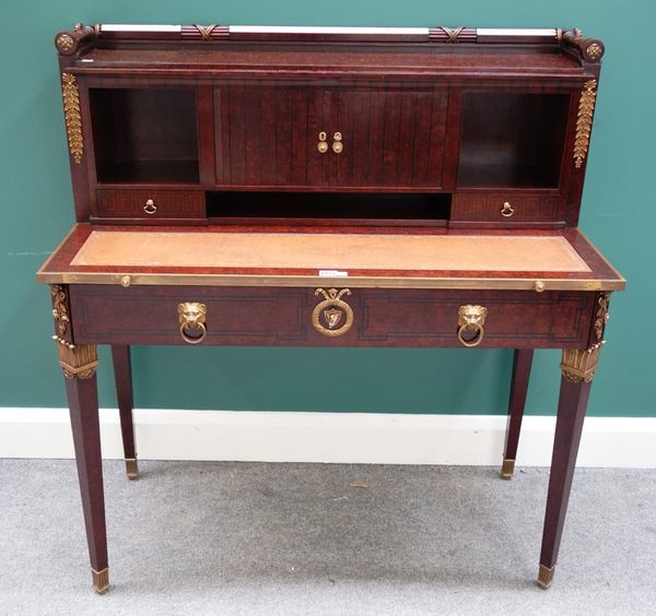 Mercier Freres, Paris; an early 20th century gilt metal mounted figured walnut writing desk, the galleried top over tambour doors, pair of drawers and