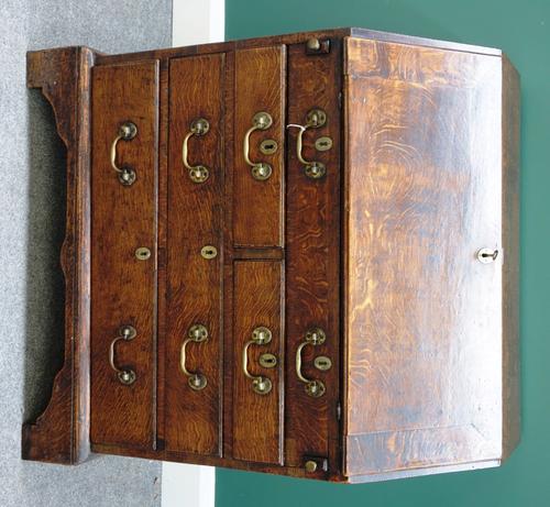 A small 18th century oak bureau, the fall enclosing a fitted interior over two short and three long graduated drawers, on bracket feet, 81cm wide x 90