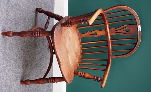 A George III ash and elm bow back Windsor chair, on turned supports, united by crinoline stretcher.