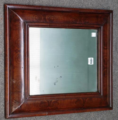 A late 17th/early 18th century rectangular walnut oyster veneered cushion framed wall mirror, 48 x 53cm.