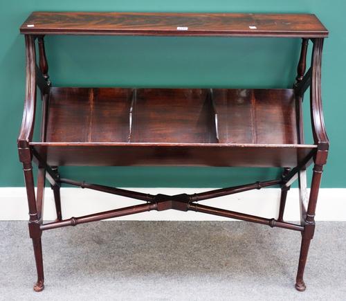 An 18th century style mahogany two tier book trough, on turned supports united by X frame stretcher, 93cm wide.
