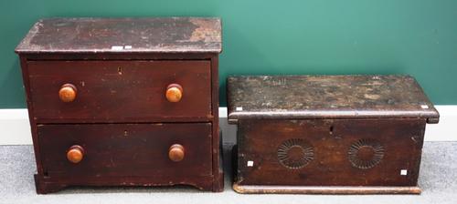 A small Victorian pine two drawer chest on plinth base, 62cm wide, together with a small 17th century oak trunk of plank construction, 68cm wide. (2)
