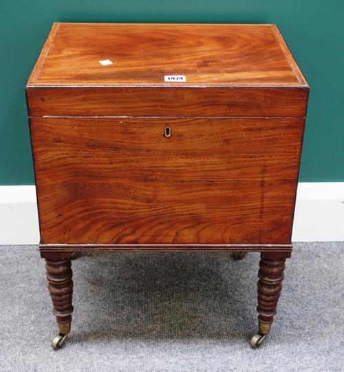 An inlaid George III mahogany cellarette, the rectangular lift top enclosing an eight division interior on tapering turned supports, 44cm wide.
