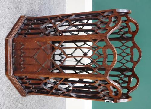 A Chippendale Revival mahogany waste paper basket, with pierced fret carved octagonal body, on plinth base, 34cm wide x 46cm high.