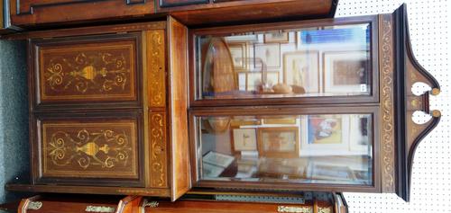 An Edwardian marquetry inlaid mahogany display cabinet cupboard, pair of bevelled glazed doors over a pair of drawers and cupboards on tapering square