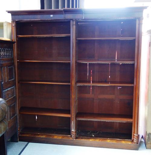 A 19th century mahogany floor standing twin section open bookcase with triple turned column decoration and swept back sides, 222cm wide x 231cm high.