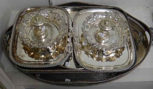 A group of silver plated wares, comprising; a pair of Old Sheffield plate rectangular trays, with gadrooned borders, a circular tray, two oval gallery