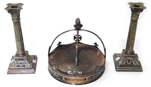 A plated circular cake stand, designed as a crown, having a Queen Victoria bust finial and a pair of plated table candlesticks, in a neo classical Cor