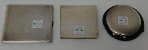 A lady's silver rectangular powder compact, a lady's silver circular powder compact and a silver rectangular cigarette case, Birmingham 1927, all with