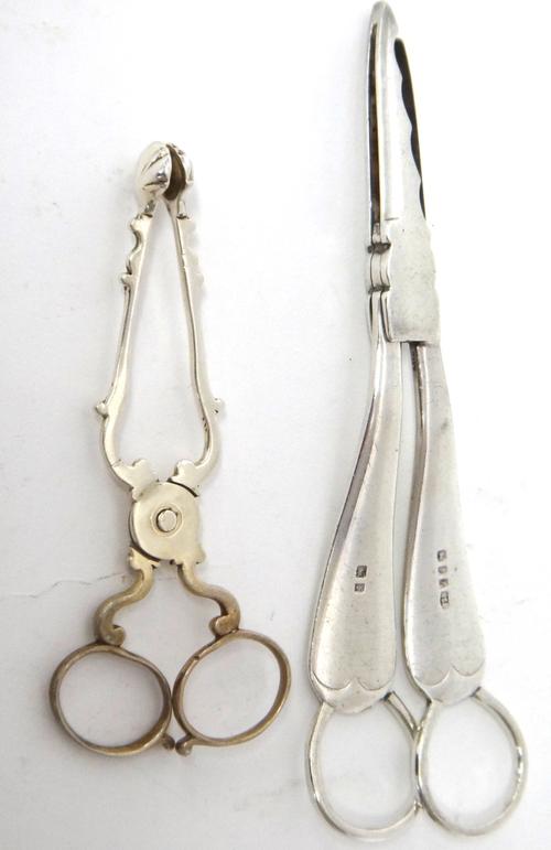 A pair of silver grape scissors, London 1924 and a pair of silver scissor action sugar nips, circa 1800, (2).